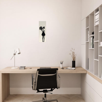 Minimalist home office workspace with a simple wooden desk and black office chair.