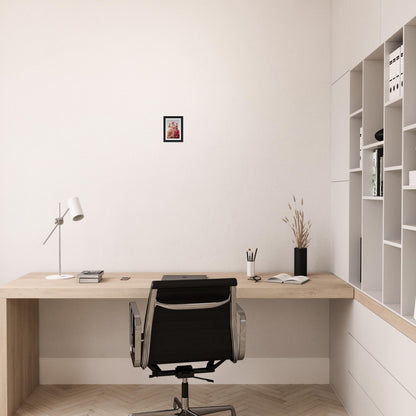 Minimalist wooden desk with a black office chair in a clean, white room.