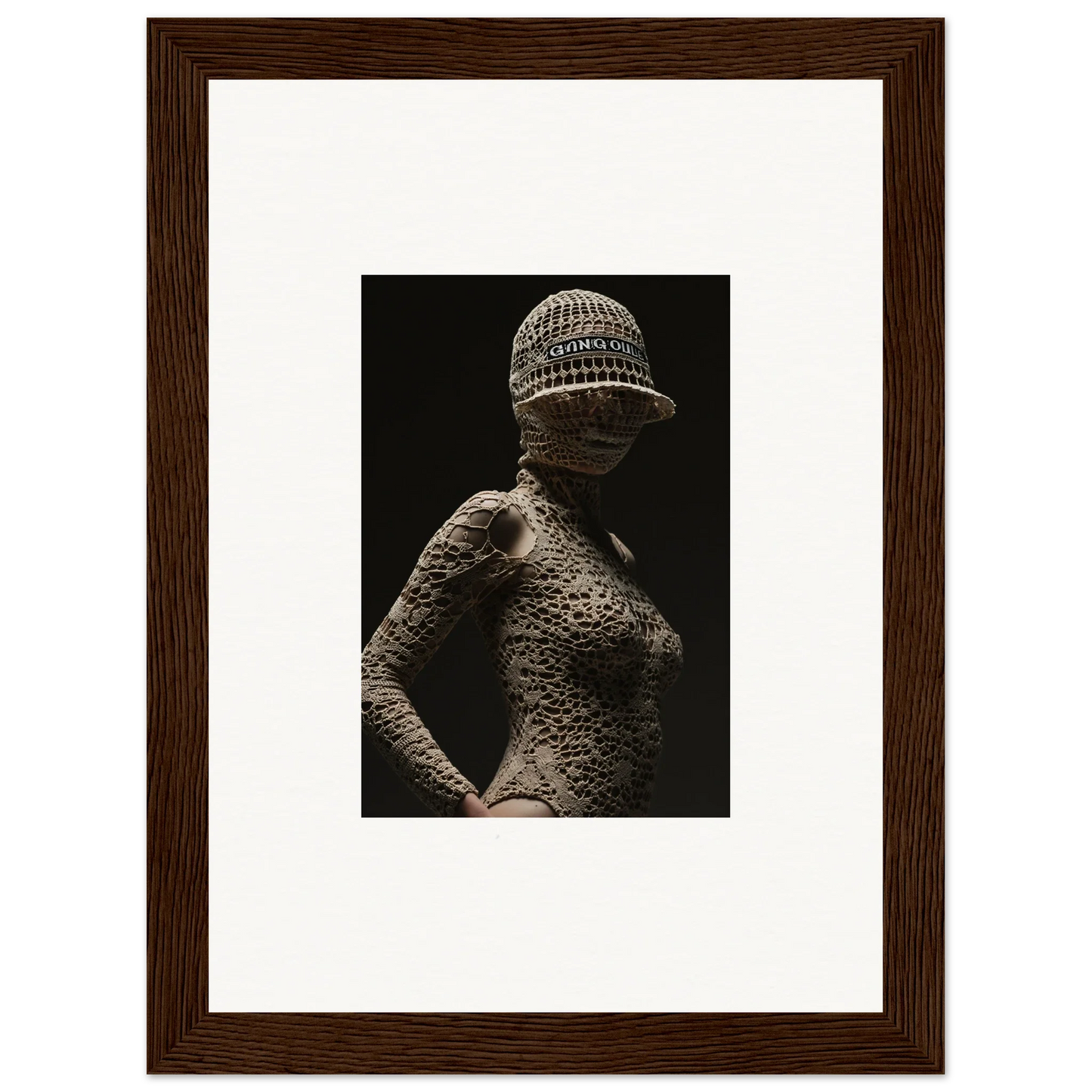 Textured sculpture of a female figure wearing a patterned cap.