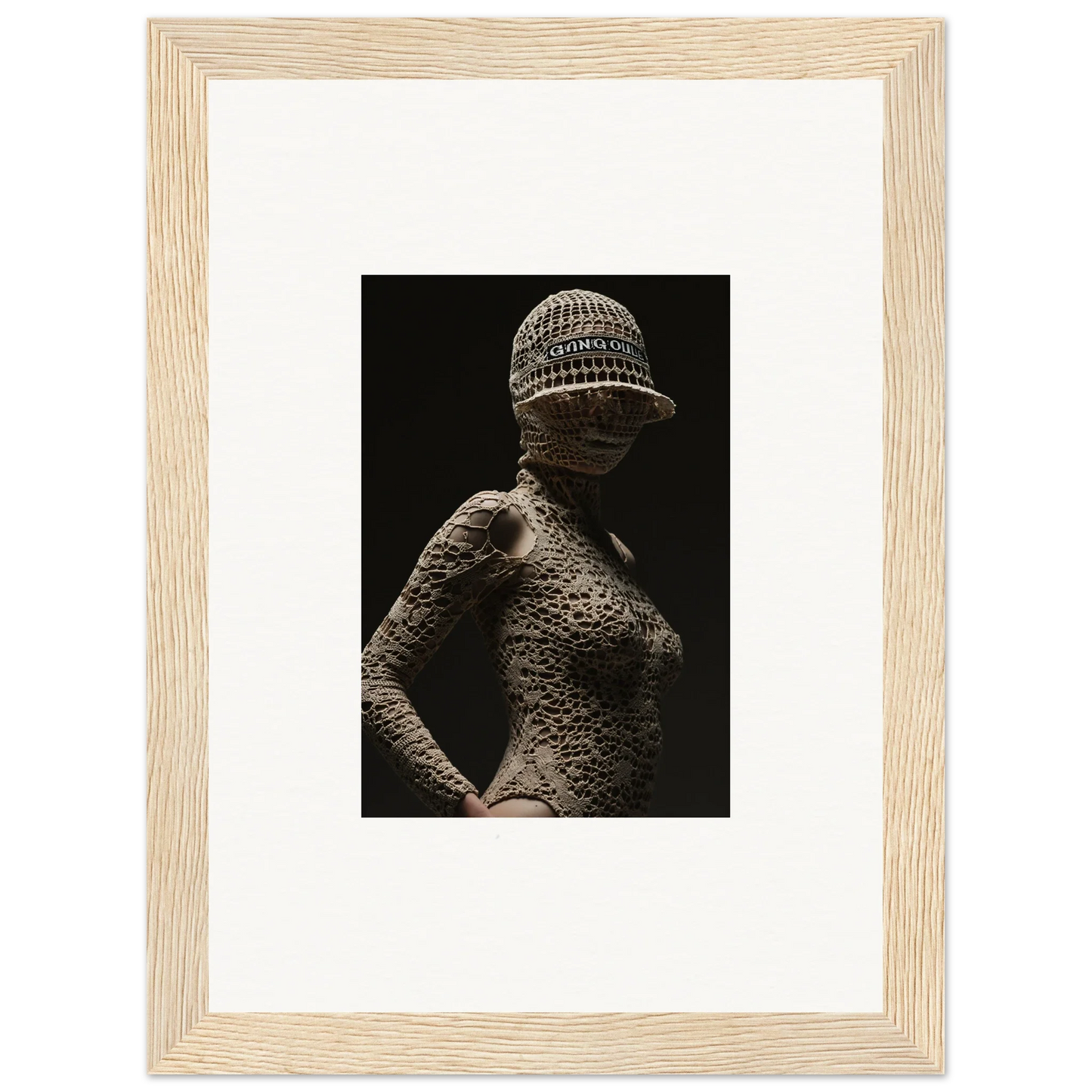 Textured sculpture of a female figure wearing a patterned cap.