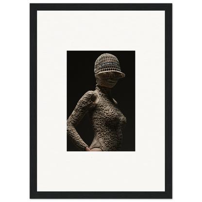 Textured sculpture of a female figure wearing a patterned cap.