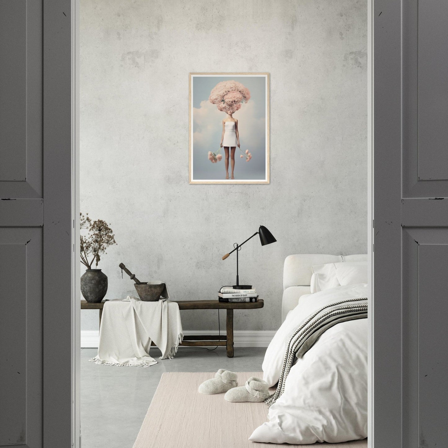 Minimalist bedroom with a surrealist artwork on the wall.