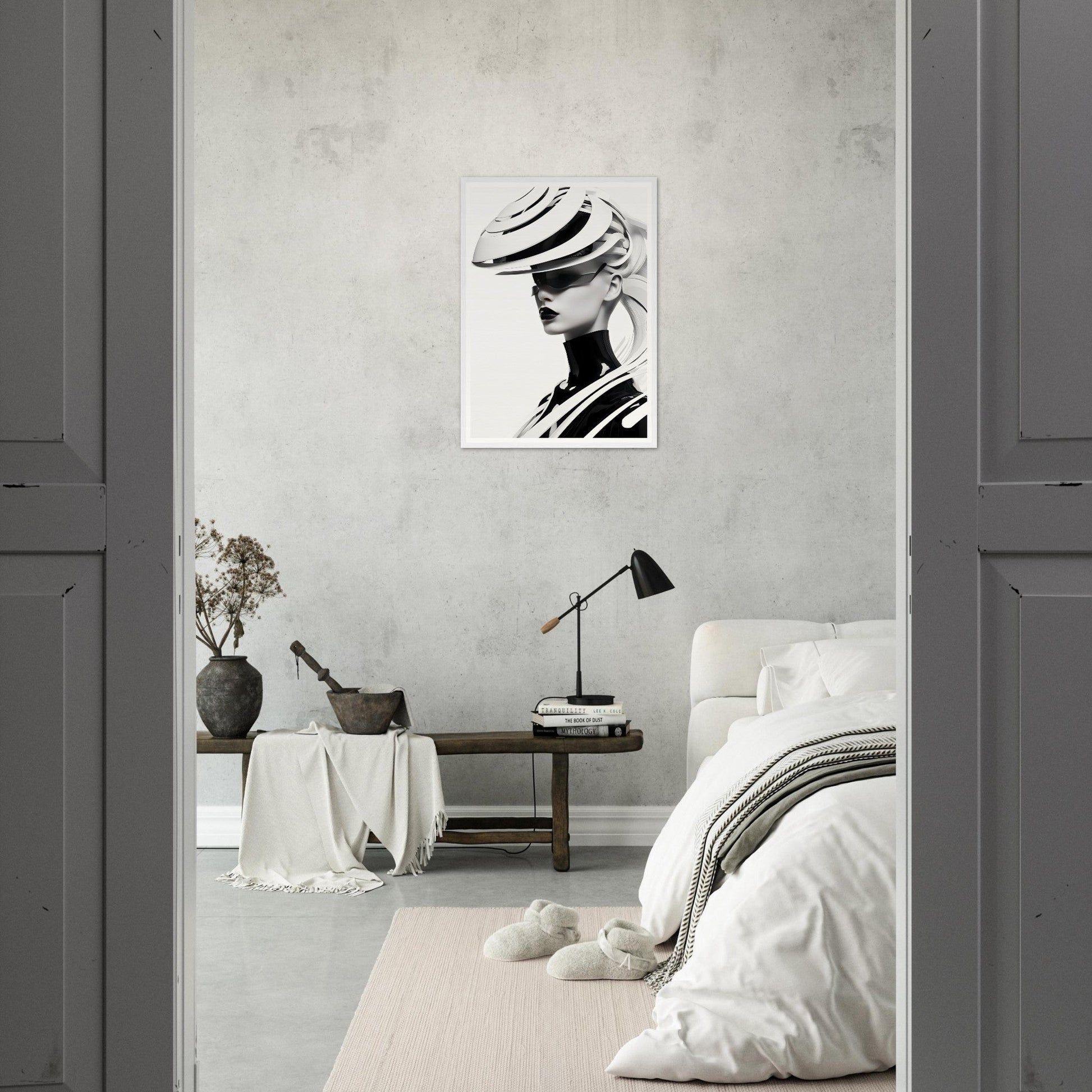 Monochromatic bedroom with minimalist decor and a striking black-and-white portrait on the wall.