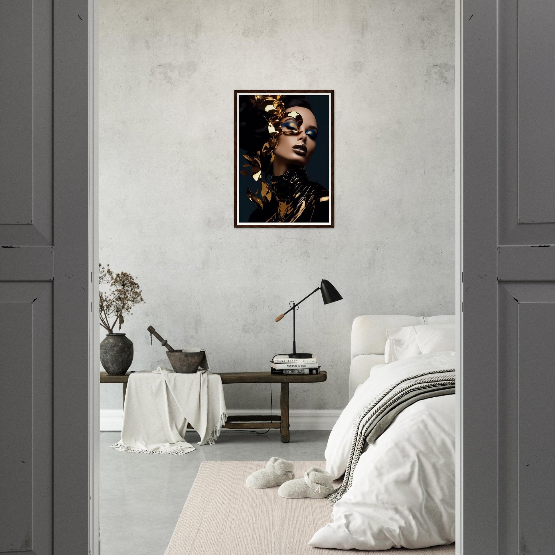 Framed portrait of a woman with gold-adorned face and dramatic makeup against a dark background.