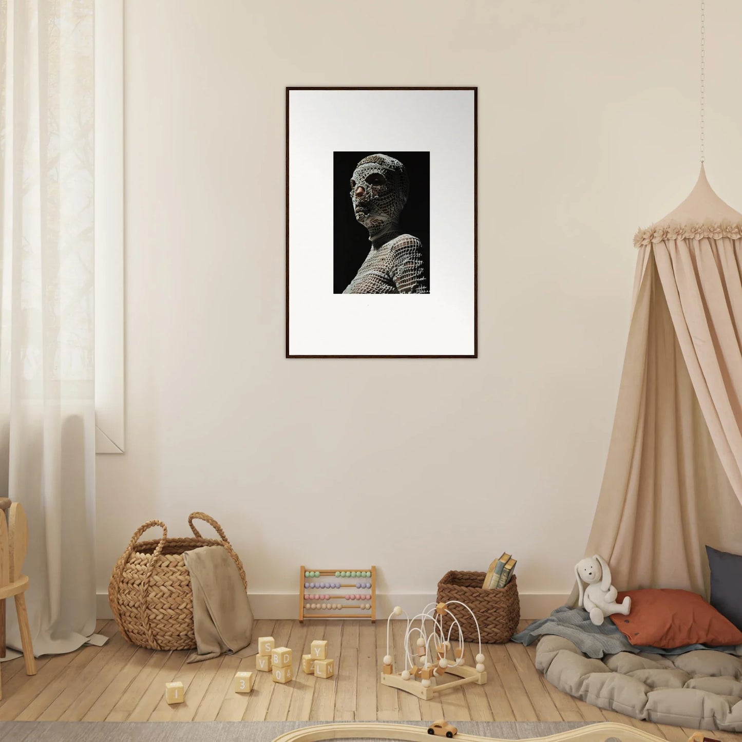 Framed black and white portrait photograph hanging on a wall.