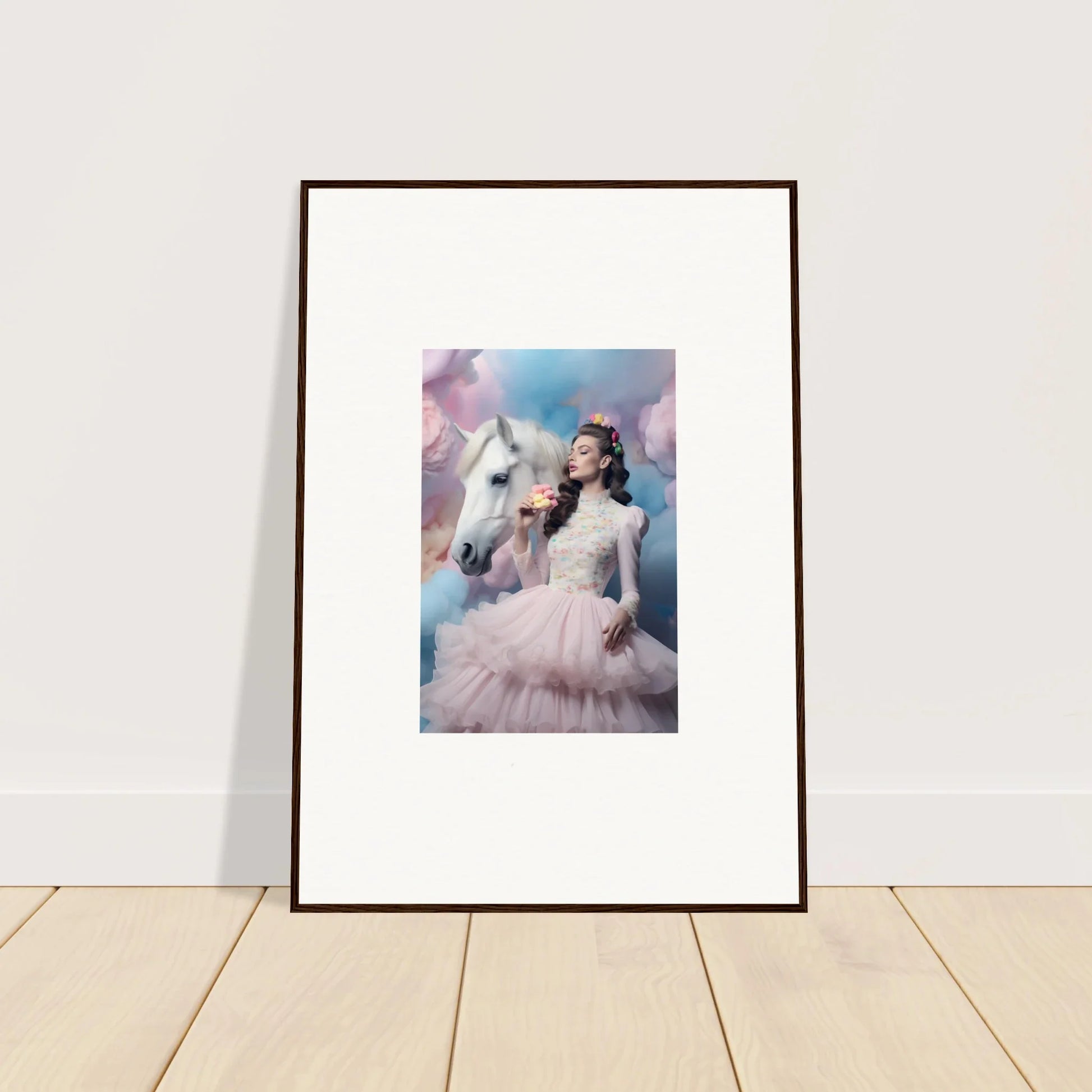 Framed artwork depicting a woman in a pink gown with a white unicorn against a dreamy sky background.