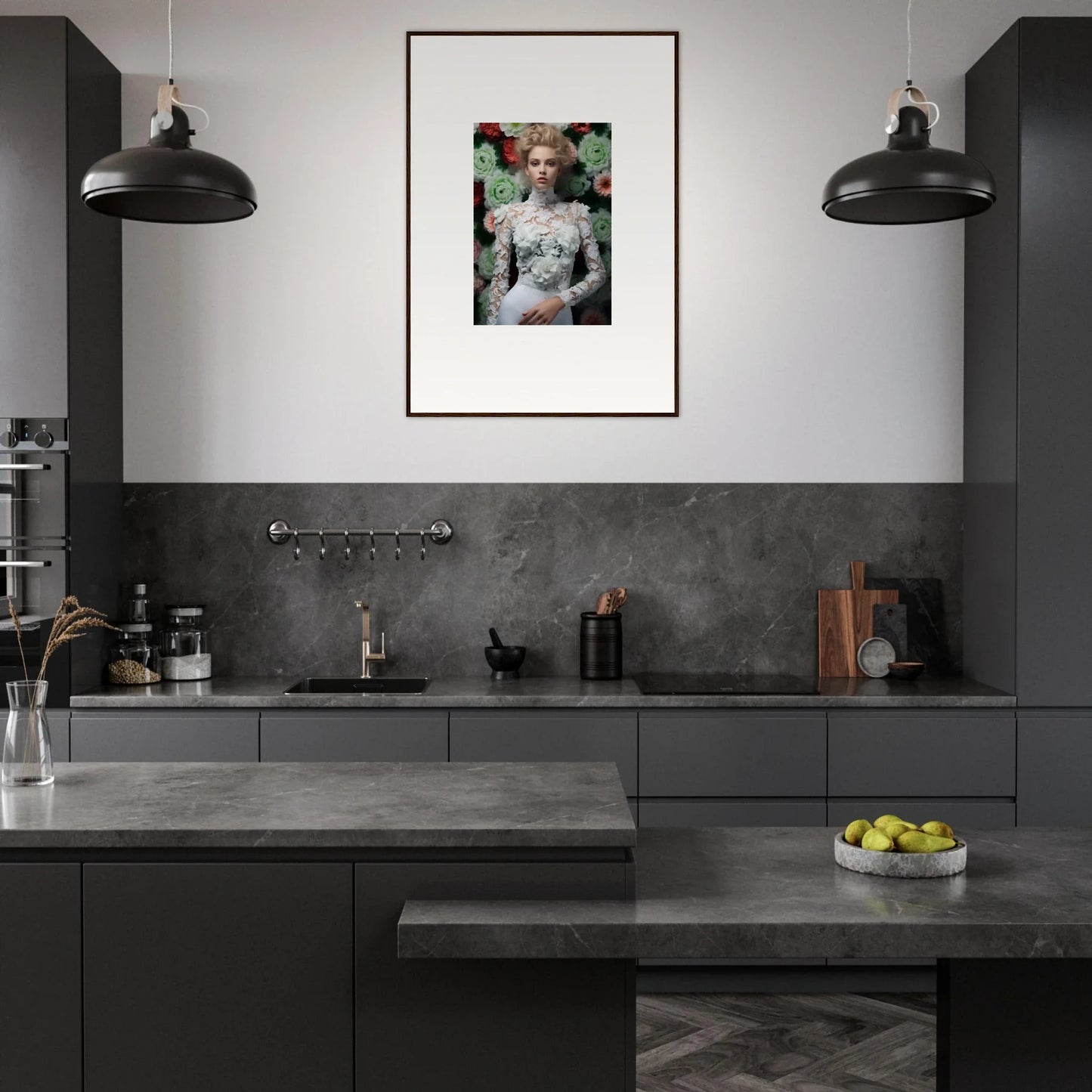 Modern kitchen with dark cabinetry, pendant lights, and a framed artwork on the wall.