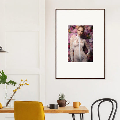 Framed portrait of a woman in a white lace dress against a floral background.