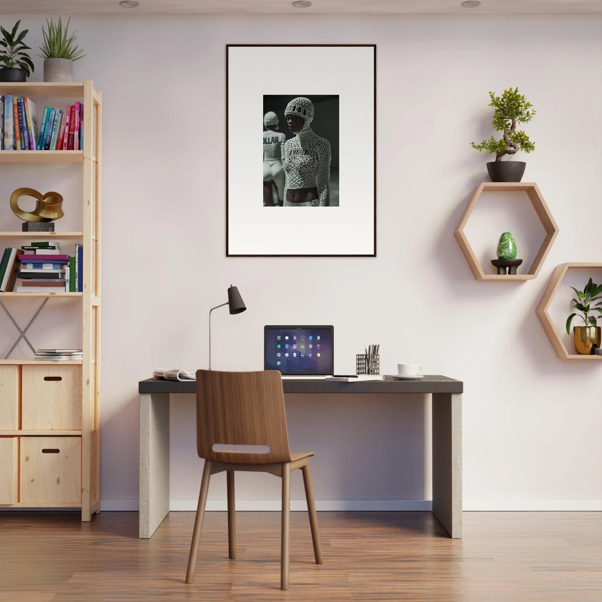 Simple home office workspace with a desk, chair, and wall decorations.