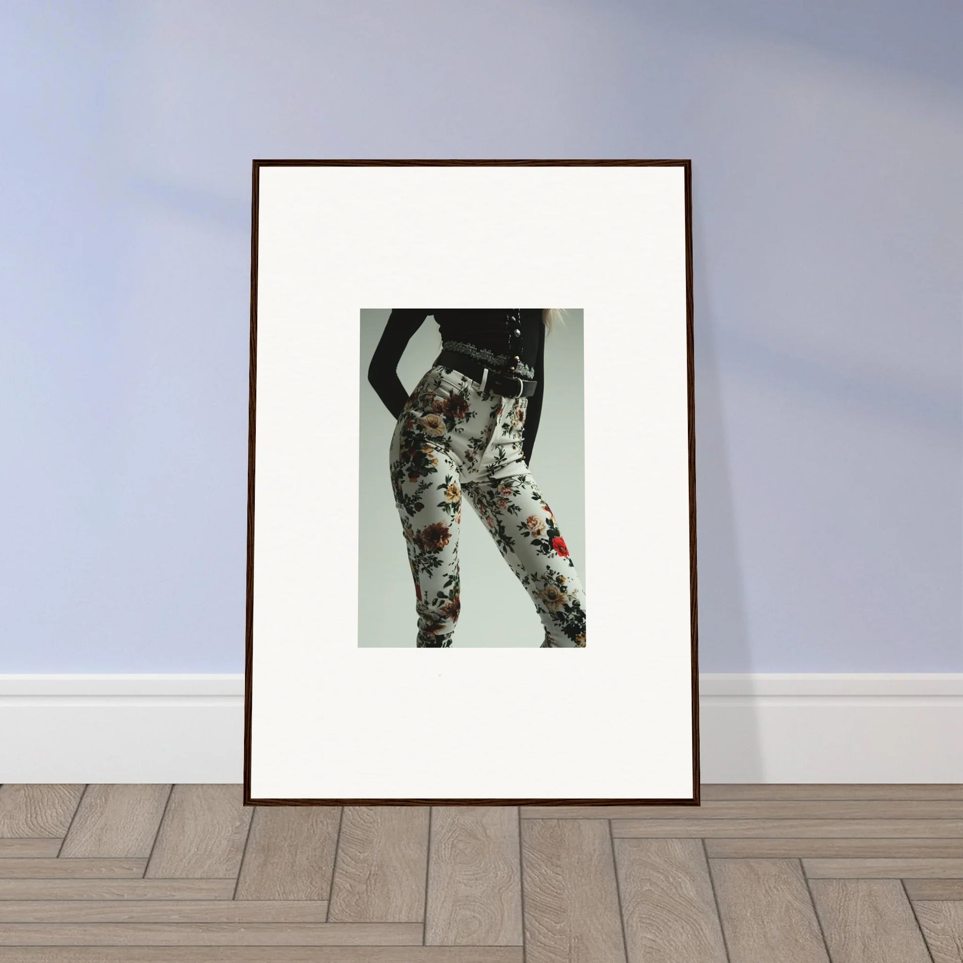 Framed artwork depicting a pair of floral-patterned pants or trousers.