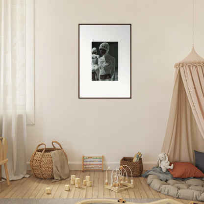 Framed black and white photograph hanging on a wall.