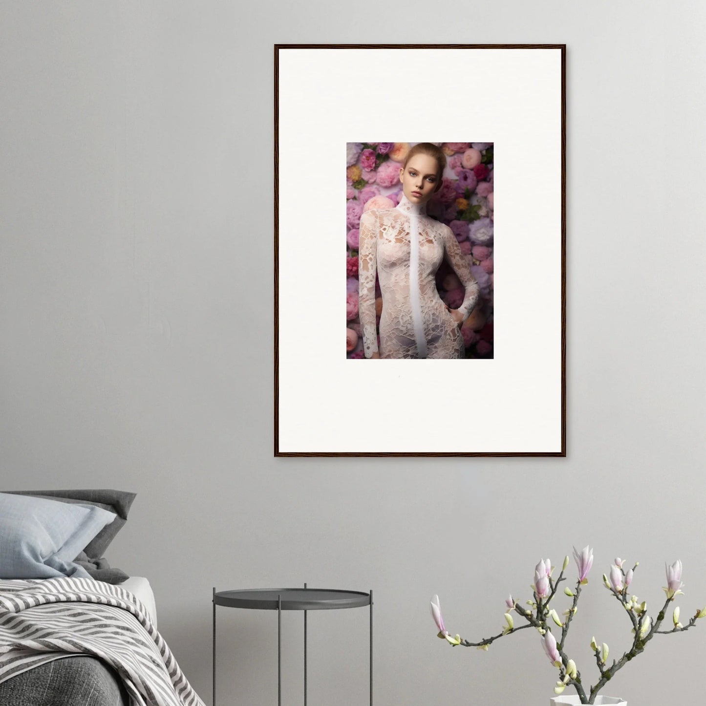 Framed portrait of a person wearing a white lace outfit surrounded by pink floral elements.