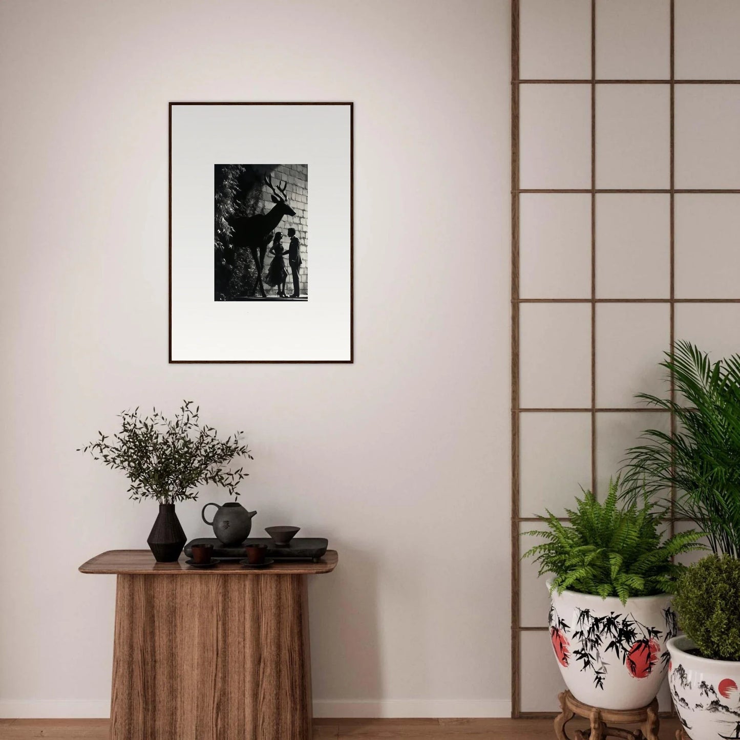 Framed black and white photograph hanging on a wall.