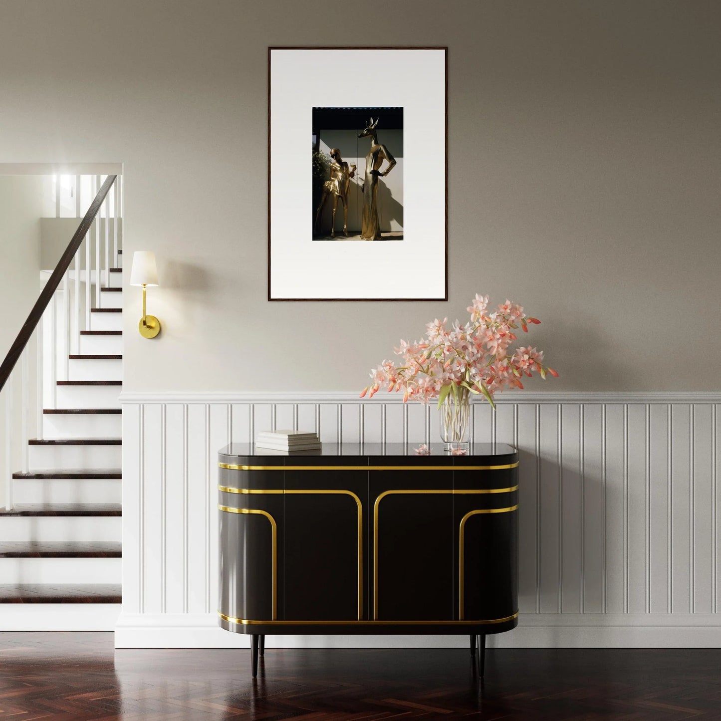 Elegant black and gold sideboard with curved edges beneath a framed artwork and floral arrangement.