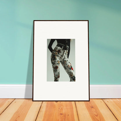 Framed black and white artwork depicting a stylized human figure with floral patterns.