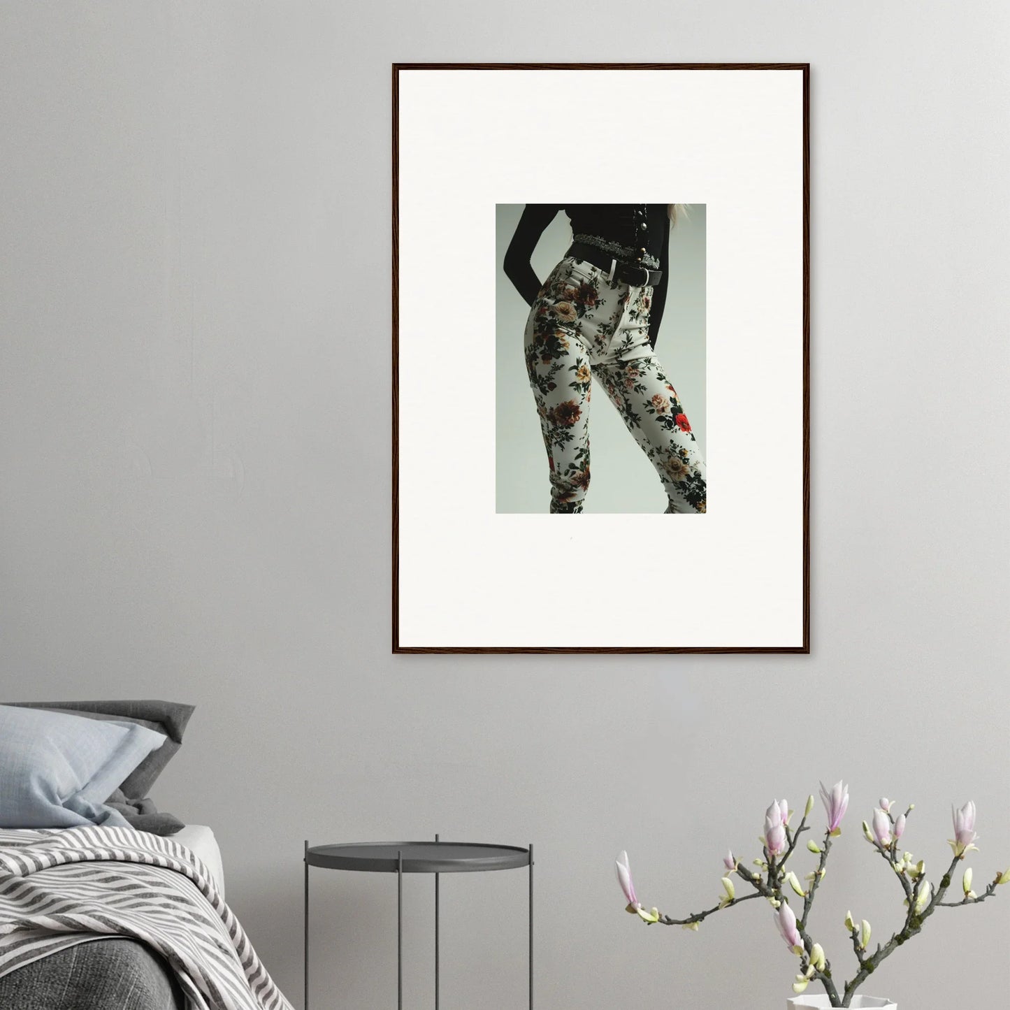 Framed photograph of a person wearing floral patterned pants.