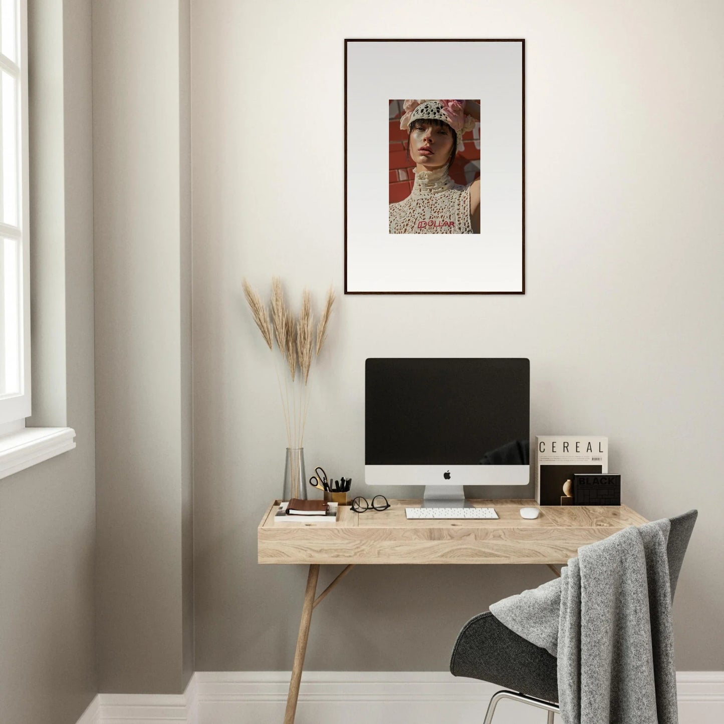 Framed portrait of a person wearing an ornate headdress or crown.