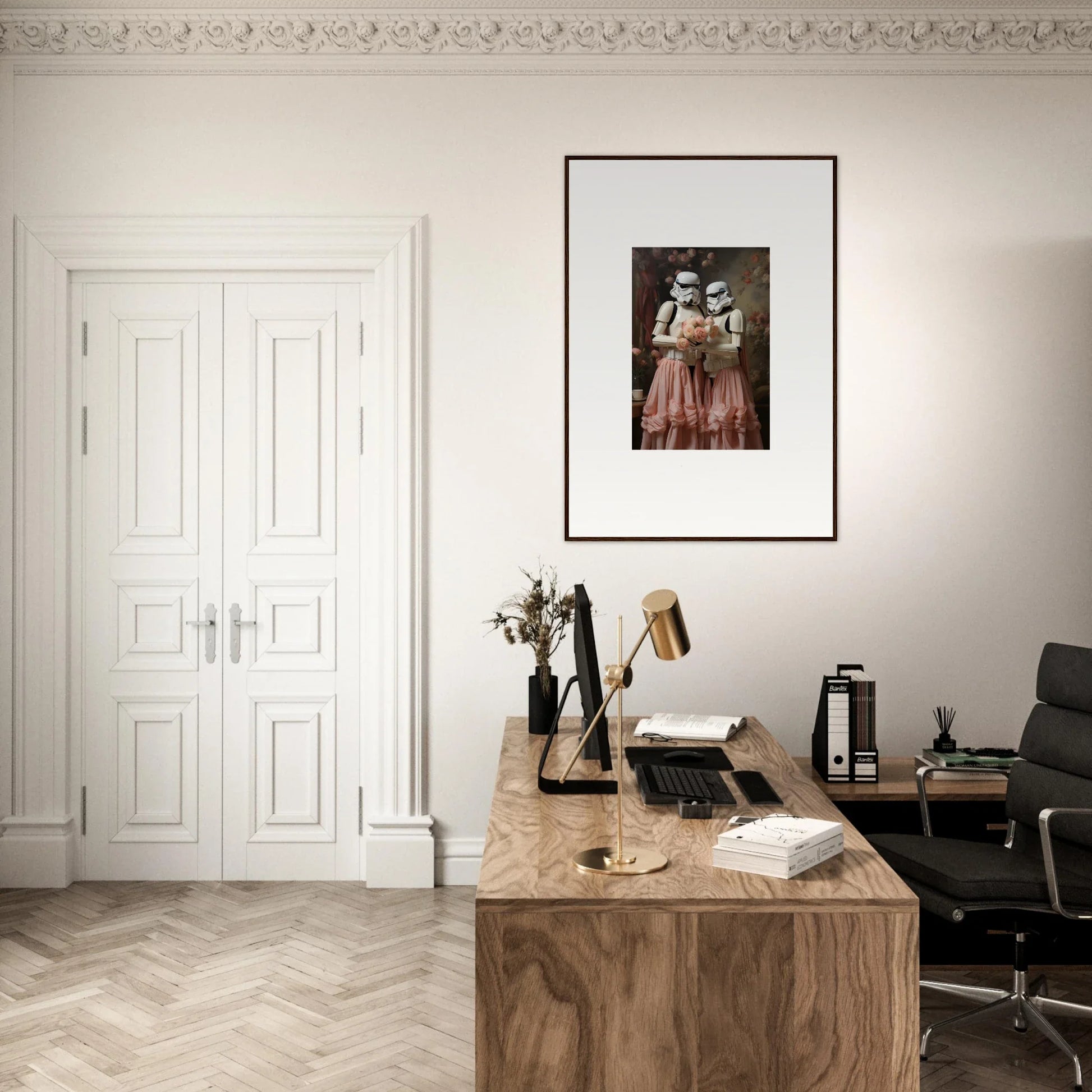 Elegant home office with a wooden desk, framed artwork, and white double doors.