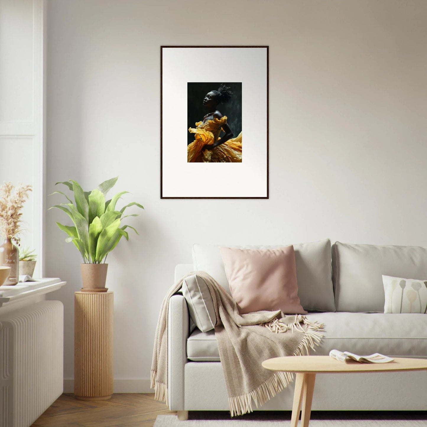 Framed artwork depicting a dark figure with golden elements against a black background.