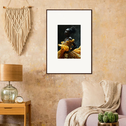 Framed artwork depicting a dark bird with yellow flowers or fabric.