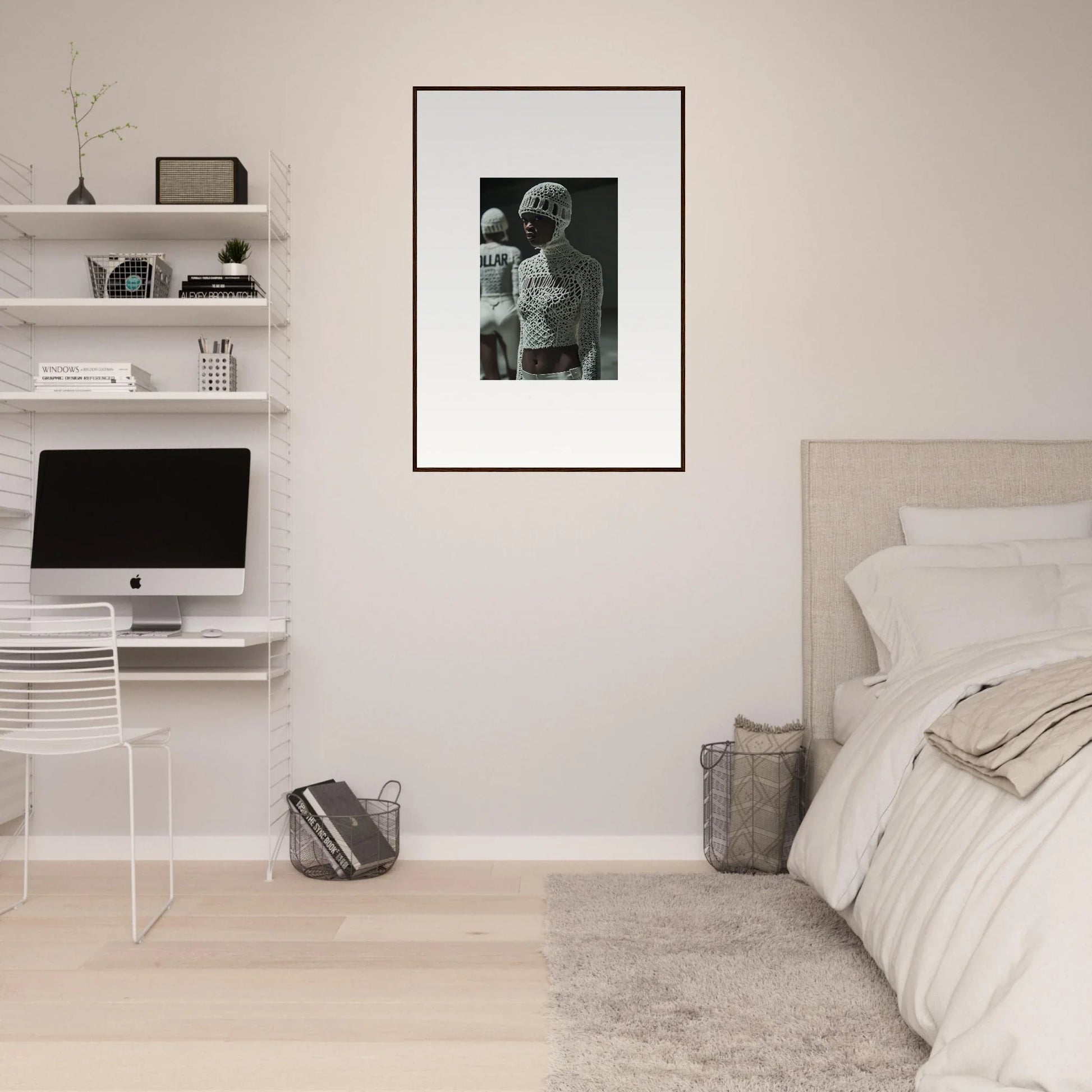 Minimalist bedroom with white walls, floating shelves, and a framed black-and-white photograph.