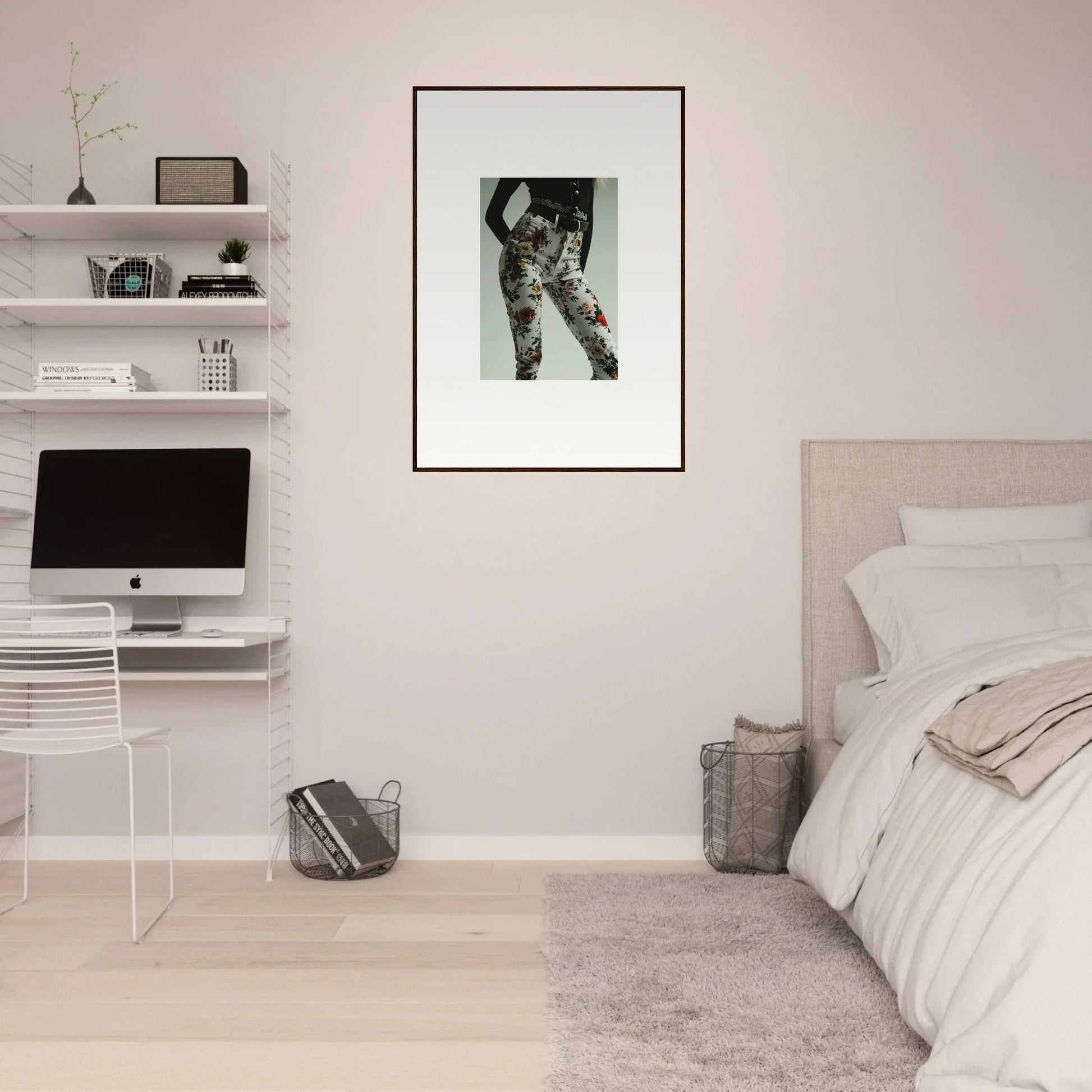 Minimalist bedroom with white walls, floating shelves, and a framed black-and-white artwork.