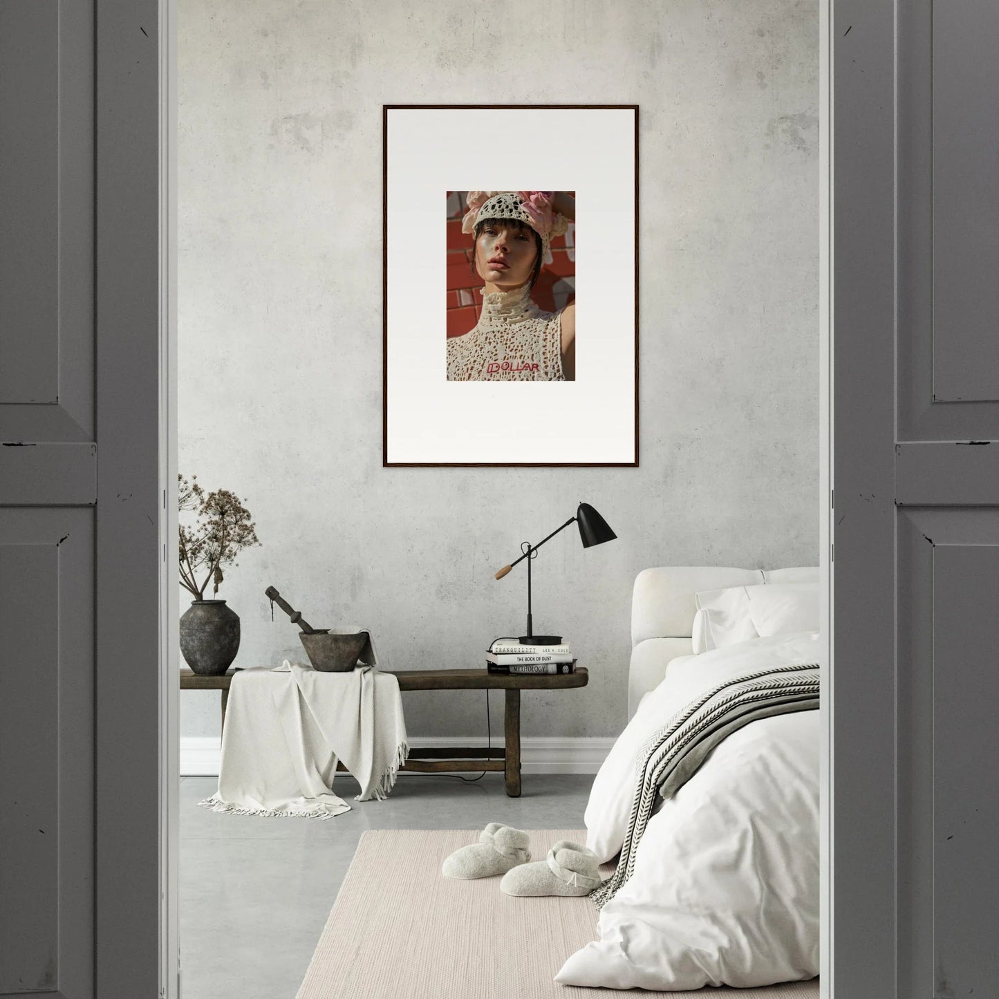 Framed portrait of a person wearing an ornate high-collared garment and hat.