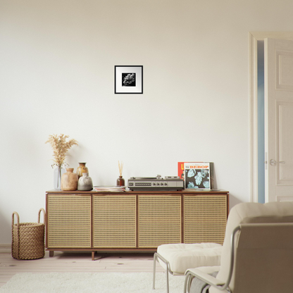 Wooden sideboard with cane-webbed doors and decorative items on top.