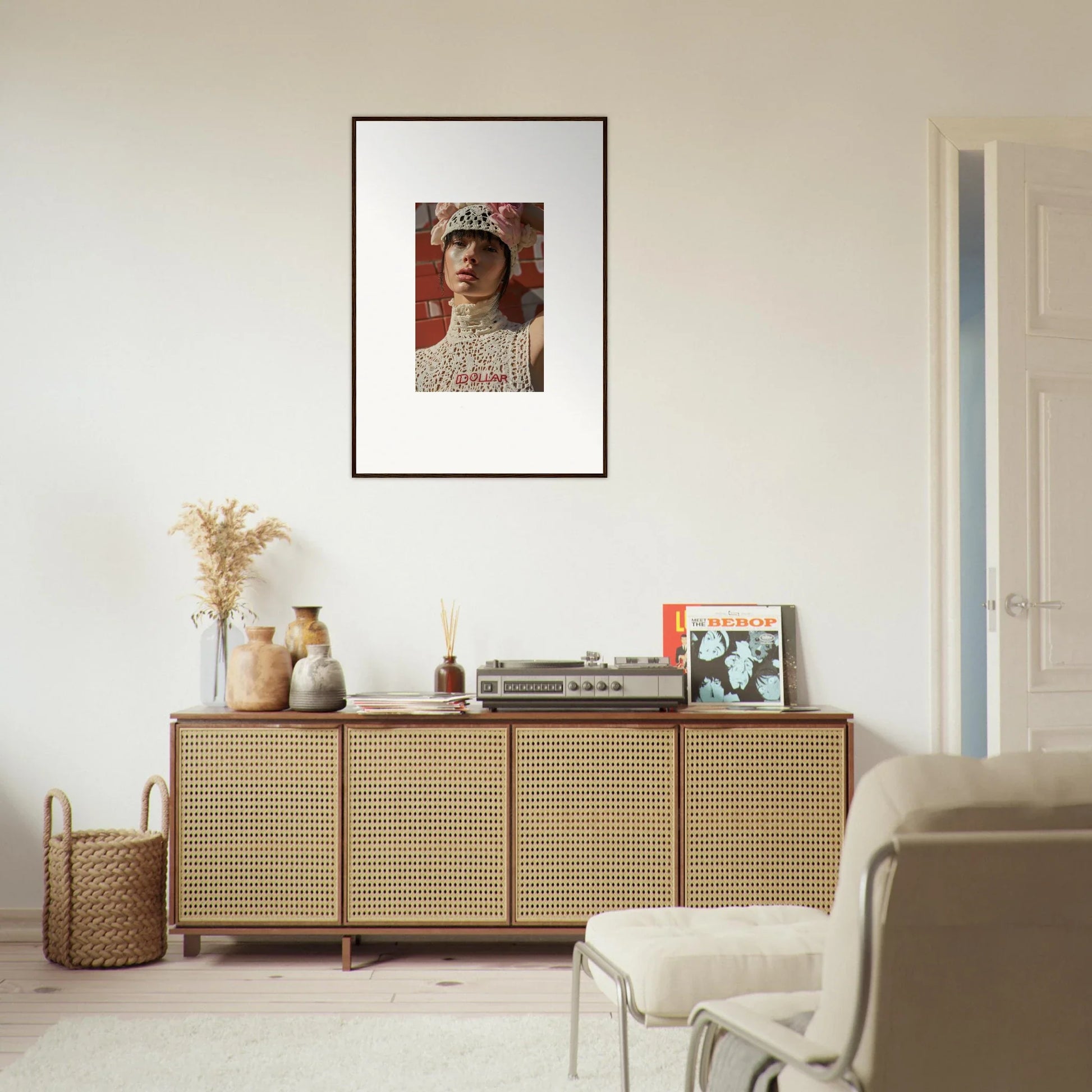 Wooden sideboard with cane-webbed doors and decorative items on top.