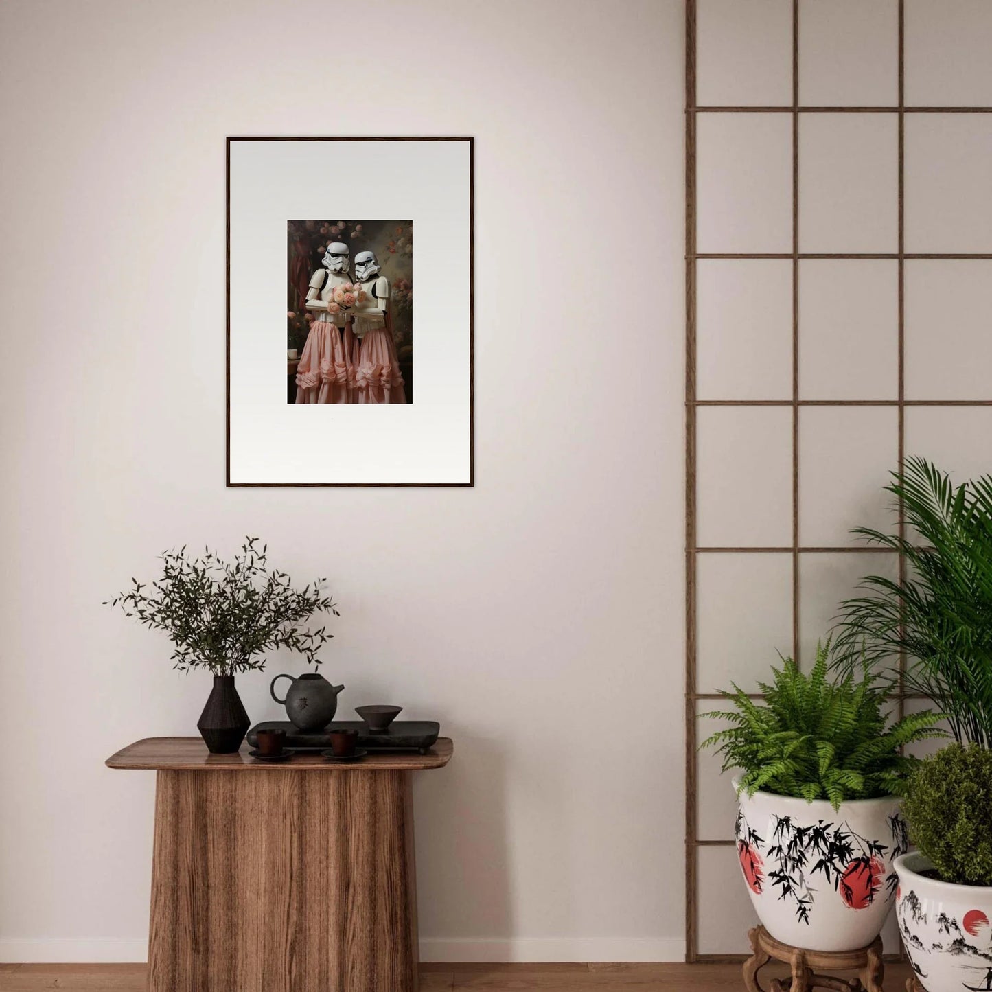 Framed black and white photograph of two figures in vintage clothing hanging on a wall.