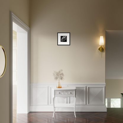 White ornate console table with curved legs against a wall.