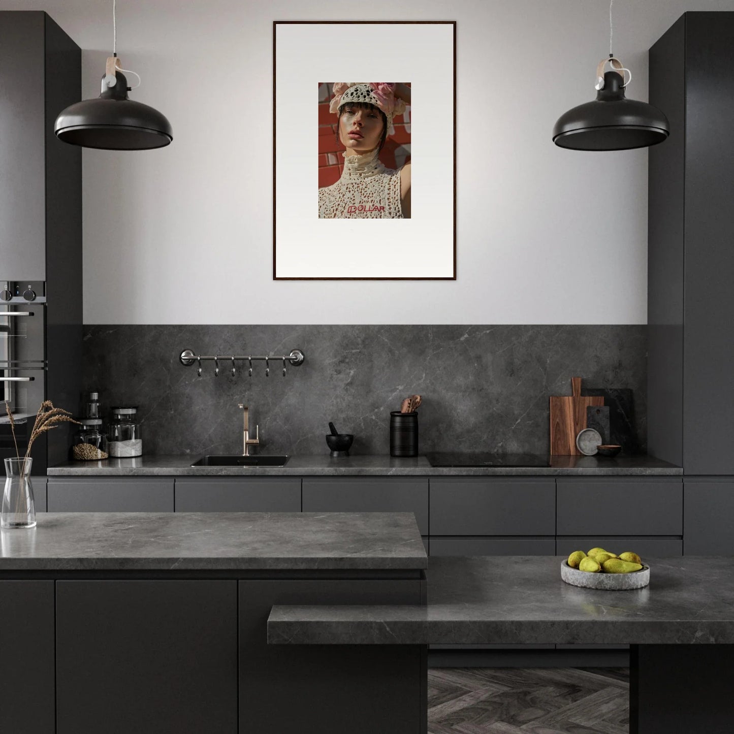 Modern, sleek kitchen with dark cabinetry and a striking framed portrait on the wall.