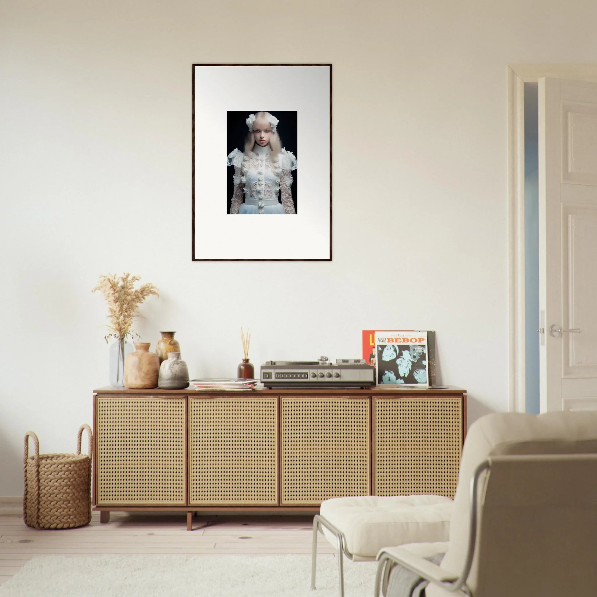 Rattan-fronted wooden sideboard with decorative items on top.