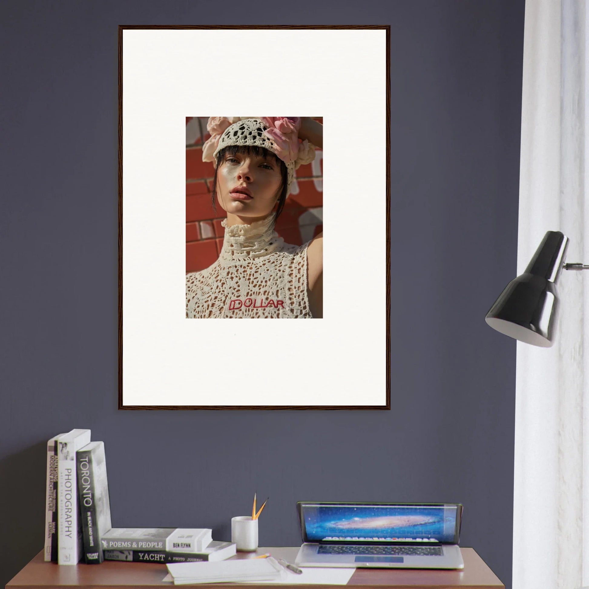 Framed portrait of a person wearing an ornate headpiece and high-necked lace garment.