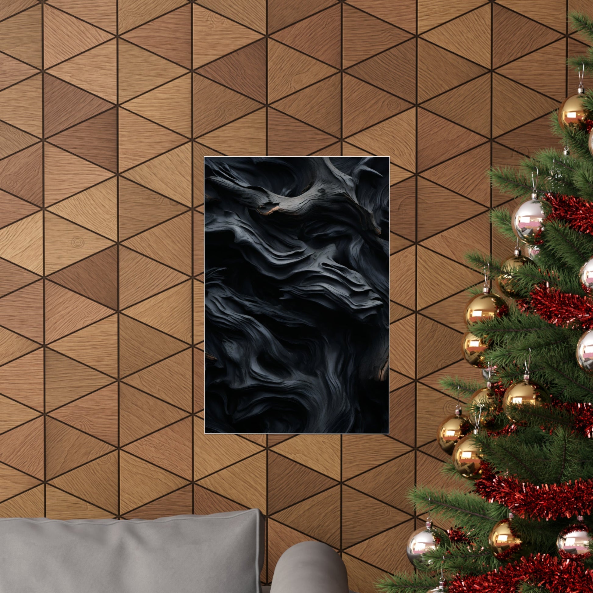 Abstract black artwork with swirling, smoky patterns mounted on a geometric wood-paneled wall.