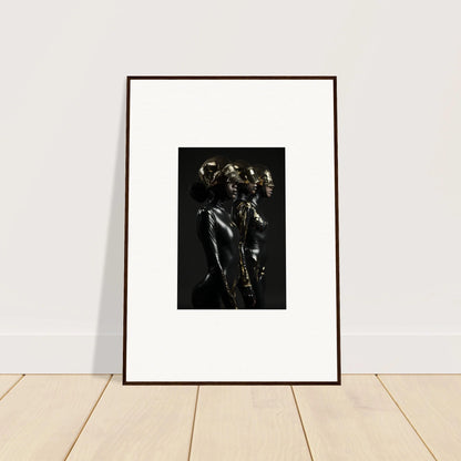 Framed black and white photograph of figures in dramatic poses.