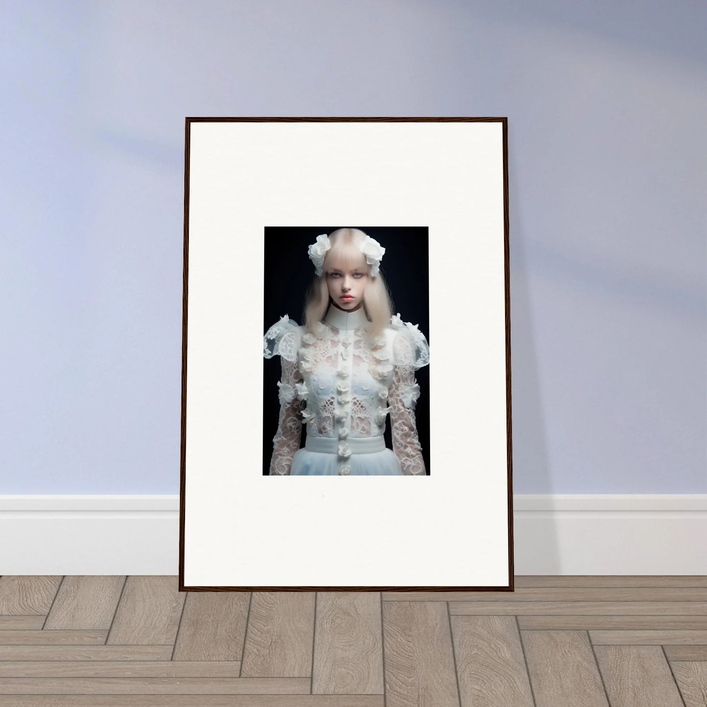 Framed photograph of a person wearing an elaborate white outfit with ruffles and a pale wig.