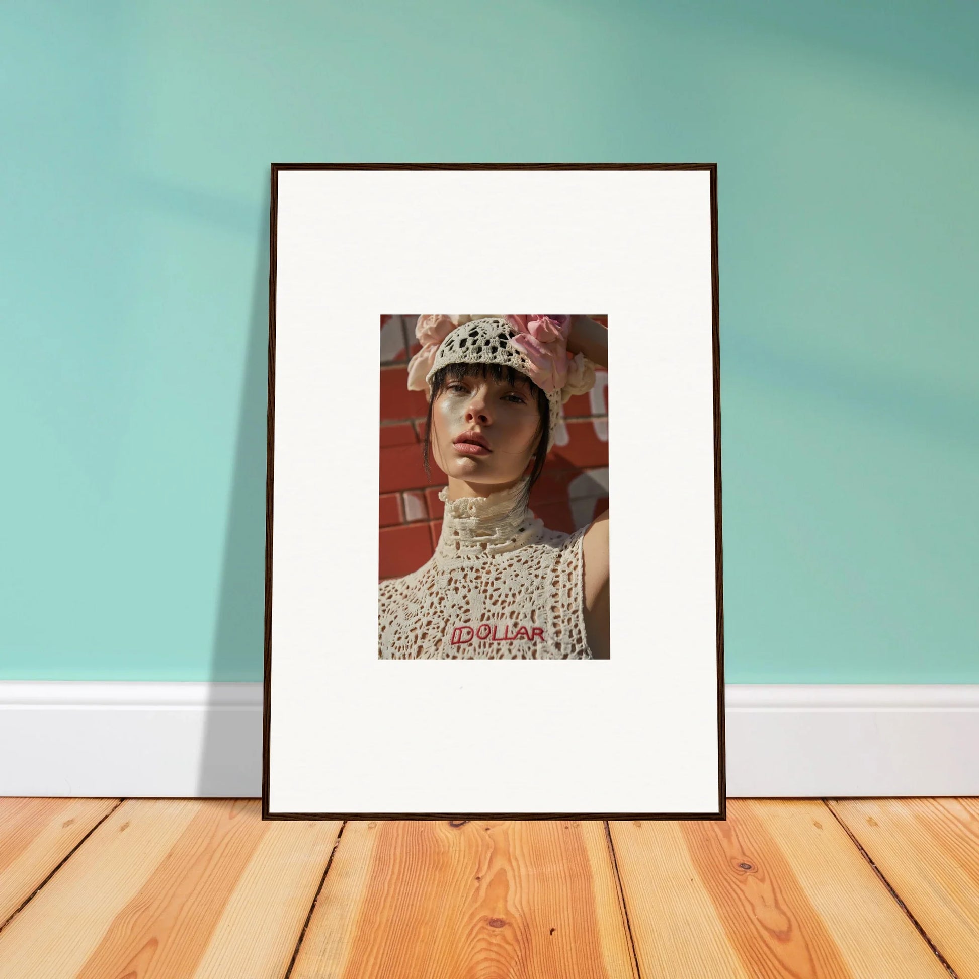 Framed portrait photograph of a person wearing a white crocheted hat and high-necked top.