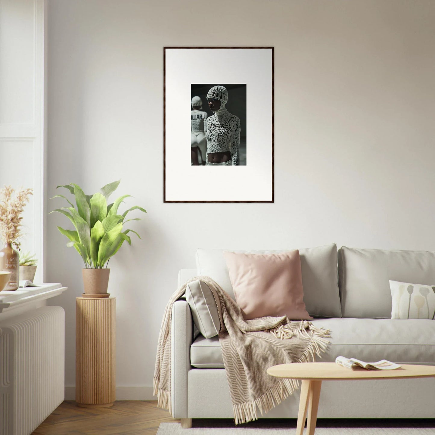 Framed black and white photograph hanging on a wall.