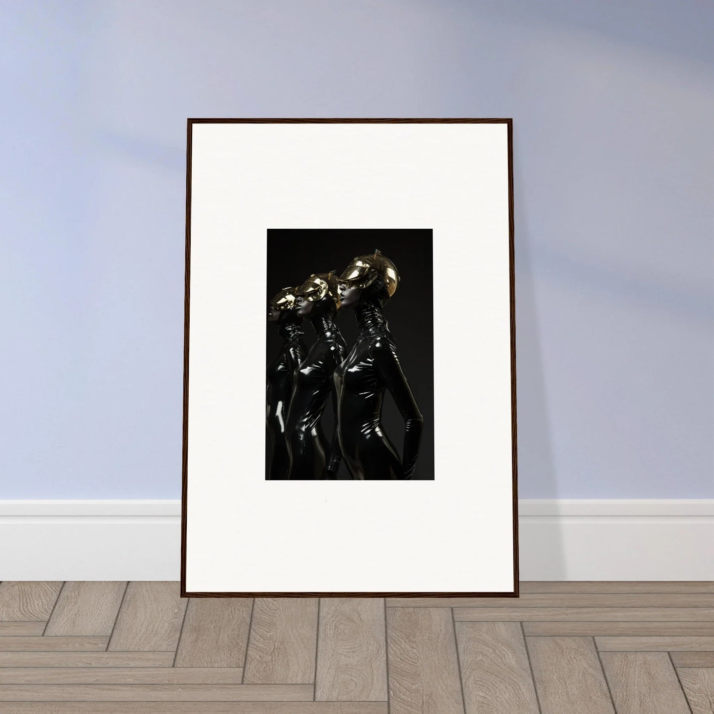 Framed black and white photograph of two skeletal figures embracing.