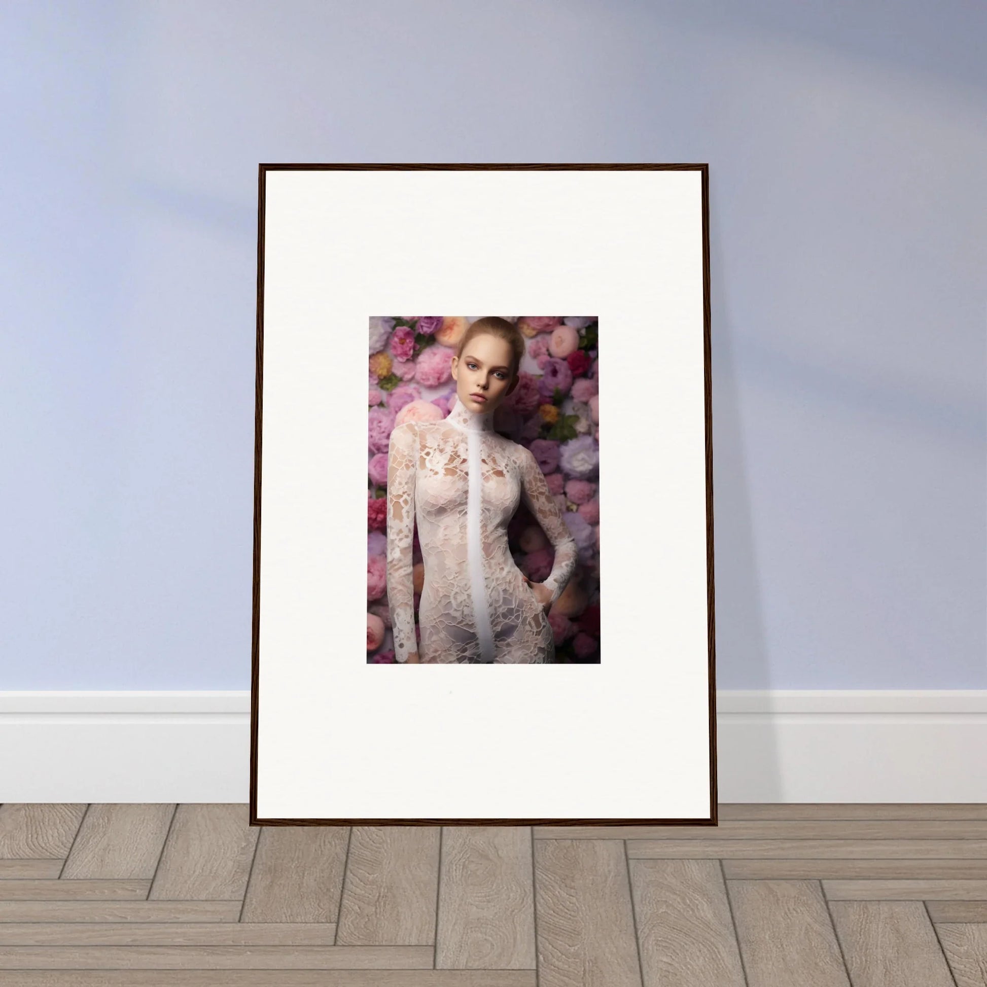 Framed portrait photograph of a woman in a sheer white dress against a floral background.