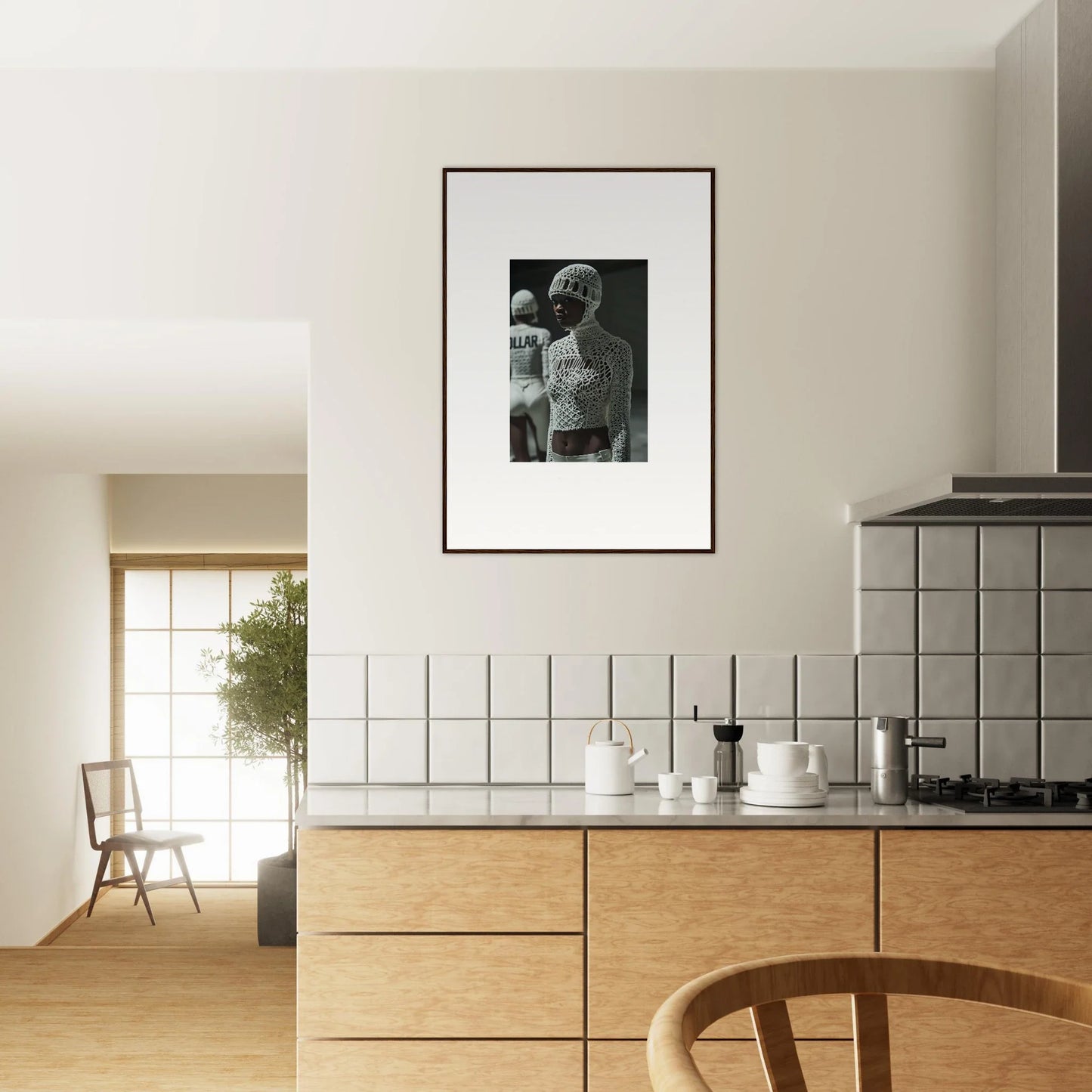 Framed black and white photograph hanging on a kitchen wall.