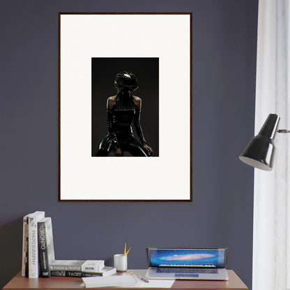 Framed black and white photograph of a silhouetted figure wearing a hat.