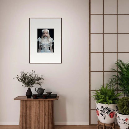 Framed photograph of a person wearing an ornate white outfit and hat.