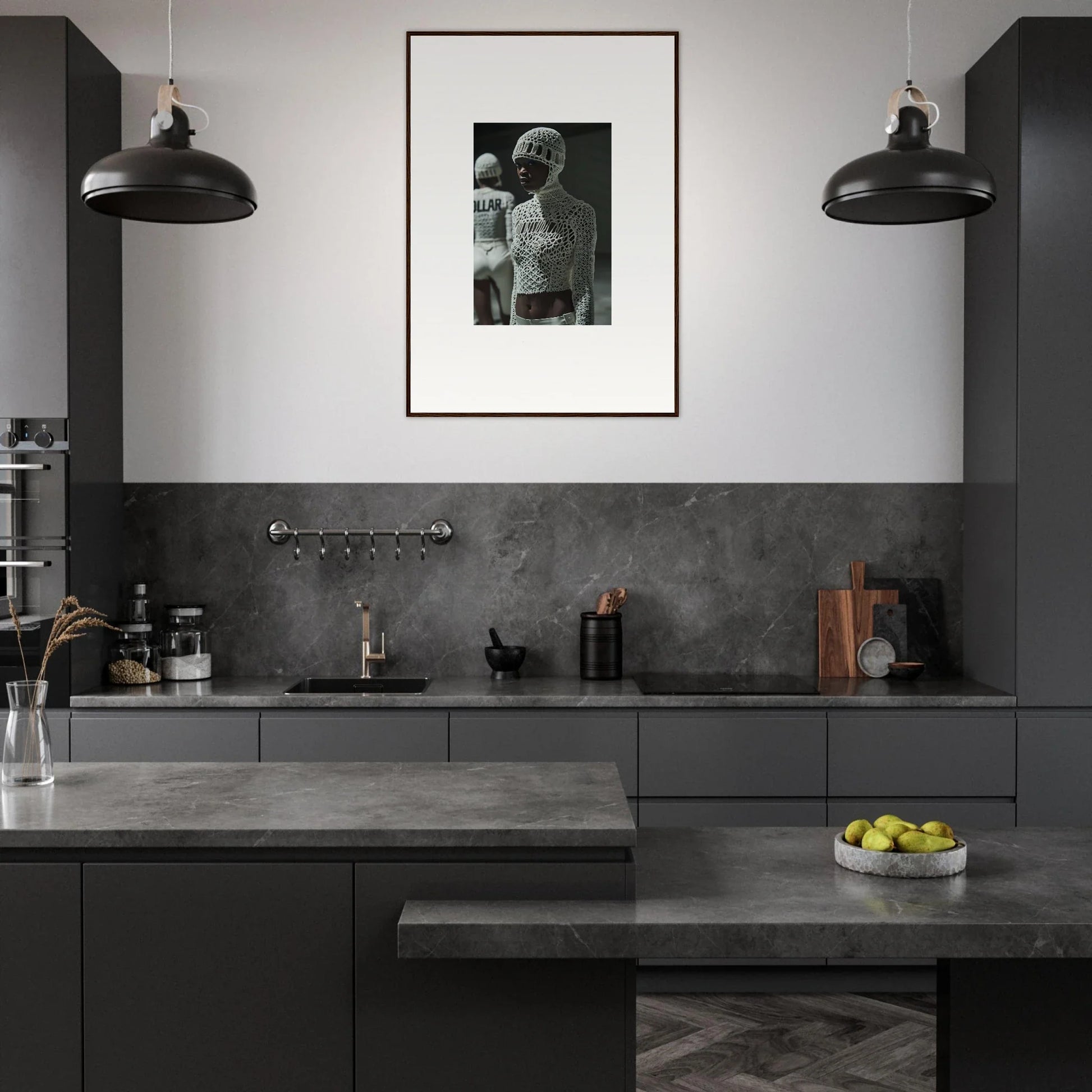 Modern kitchen with dark cabinetry, concrete countertops, and a black-and-white framed photograph on the wall.