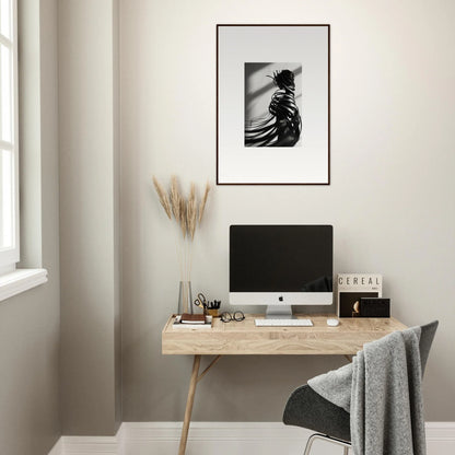 Minimalist home office with whisper twists decor, wooden desk, and canvas print art