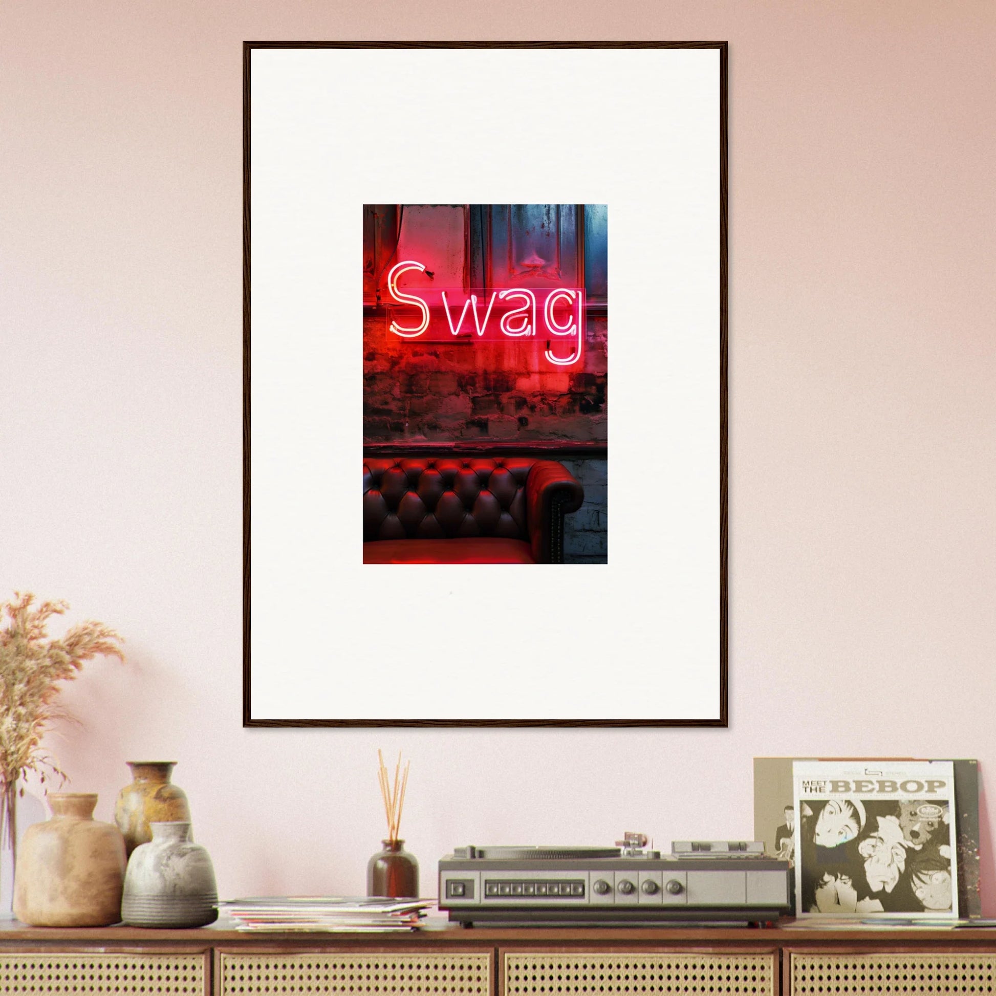 Framed neon Swag sign above a red leather couch makes awesome wall art for room decoration