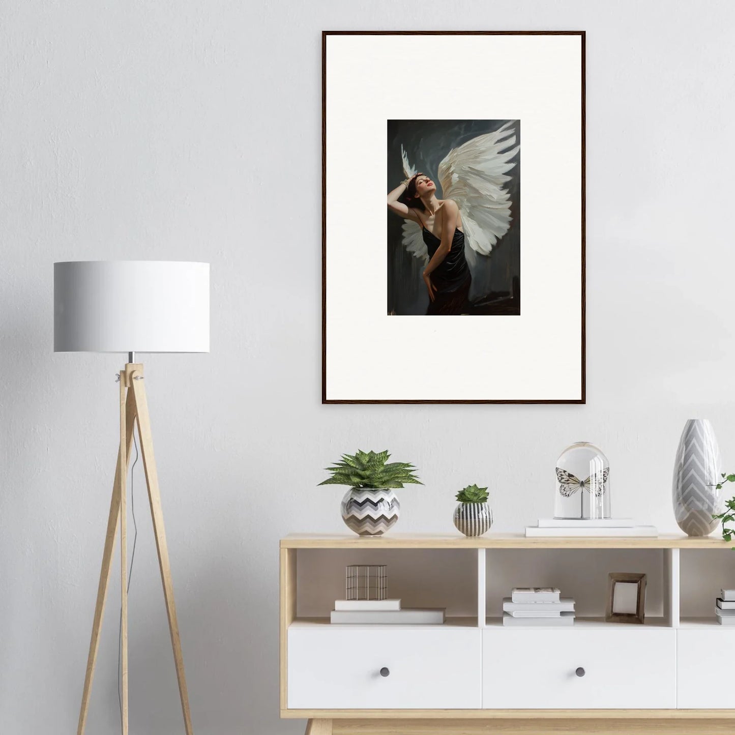 Framed canvas print of a dramatic femme ascent figure with large white wings for room decoration