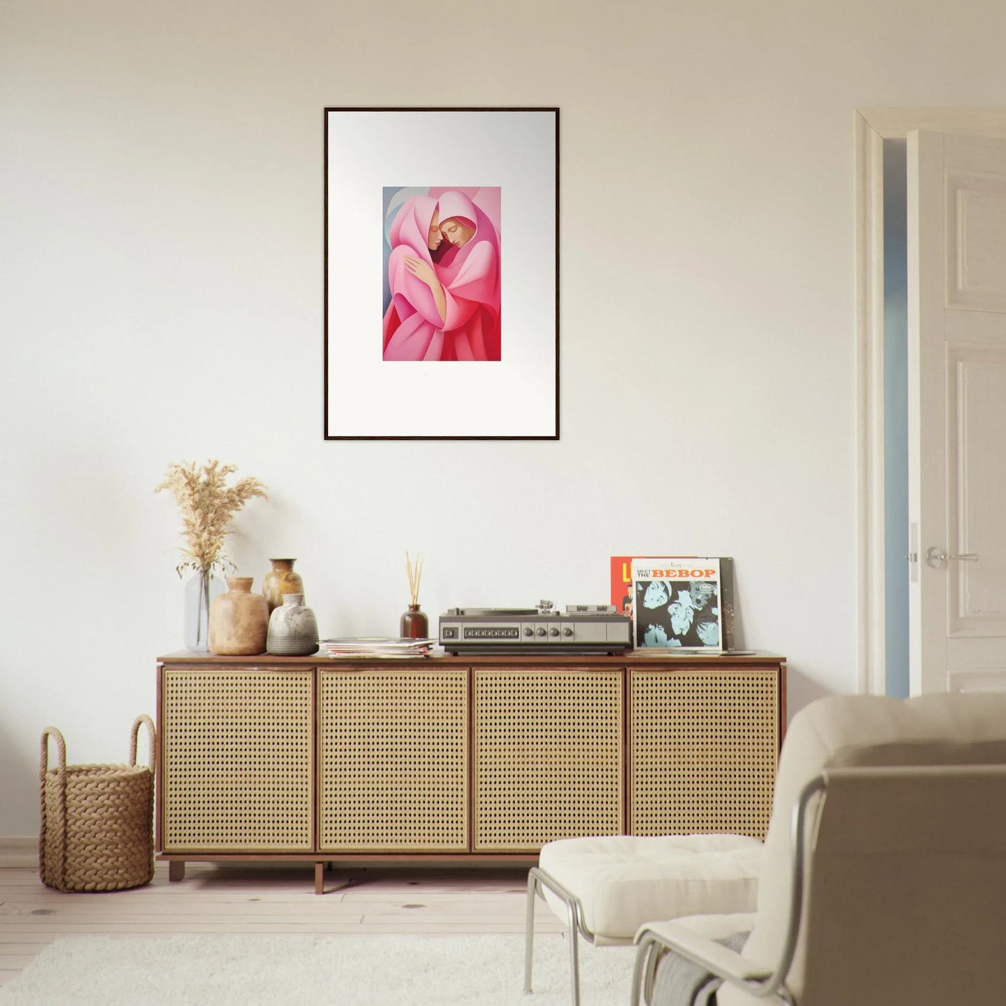 Wooden sideboard with cane doors topped by decorative items and Glimmer Verse Tapestry