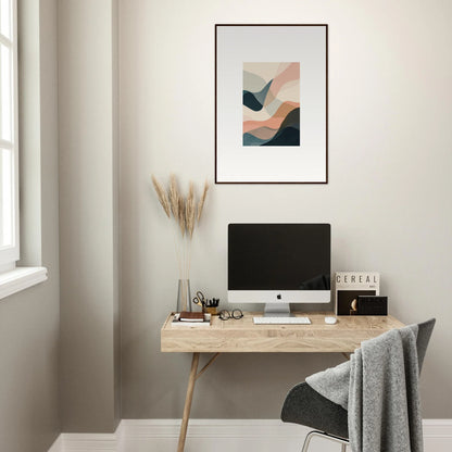 Minimalist home office with a wooden desk, computer, and abstract wall art for room decoration